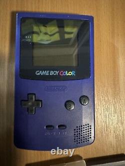 MAKE A OFFER Nintendo Game Boy Grey and Nintendo colour with games