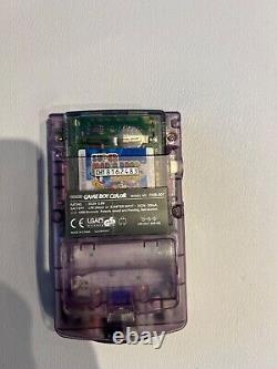 Nintendo Game Boy Colour with game Mario Brothers in clear colour
