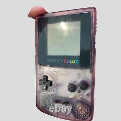 Boîte Gameboy Color Atomic Purple avec quelques manuels et console 2