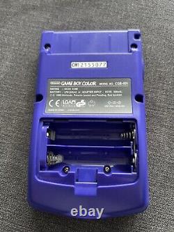 Console GameBoy Color violette raisin complète dans sa boîte avec manuels, système proche du neuf.