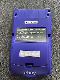 Console GameBoy Color violette raisin complète dans sa boîte avec manuels, système proche du neuf.