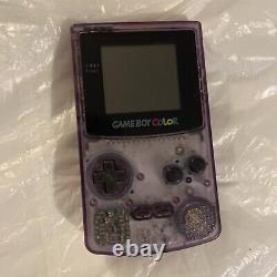 Console Nintendo Gameboy Color transparente violette atomique sans couvercle de batterie manquant