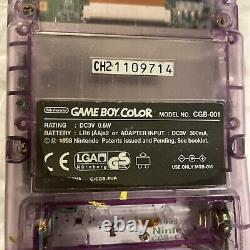 Console Nintendo Gameboy Color transparente violette atomique sans couvercle de batterie manquant