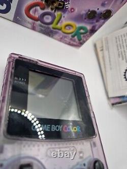 Game Boy Color violet atomique en boîte avec tous les manuels et la console