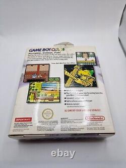 Game Boy Color violet atomique en boîte avec tous les manuels et la console