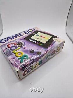 Game Boy Color violet atomique en boîte avec tous les manuels et la console