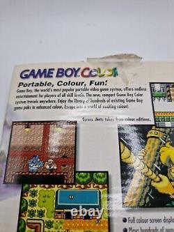 Game Boy Color violette atomique en boîte avec tous les manuels et la console