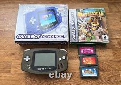 Système de console portable Nintendo Game Boy Advance violette. Lot de 4 jeux Mario inclus dans la boîte.