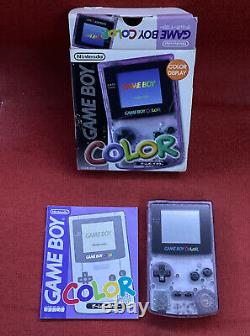 Système portable Nintendo Game Boy Color Atomic Purple en boîte avec manuel