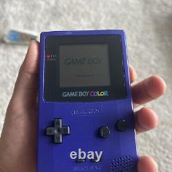 Système portable Nintendo Game Boy raisin avec 2 jeux